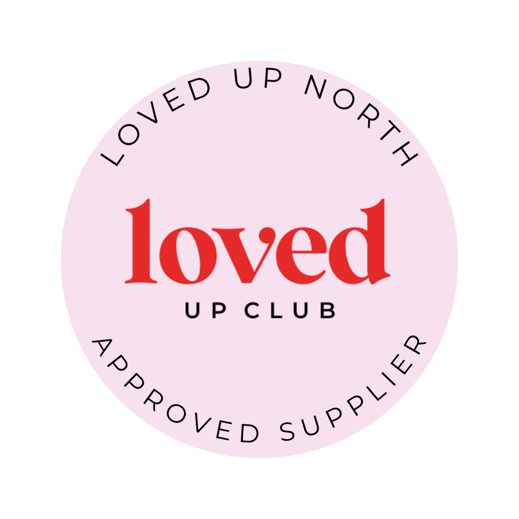 Circular badge with 'Loved Up North' and 'loved up club' text on a pink background